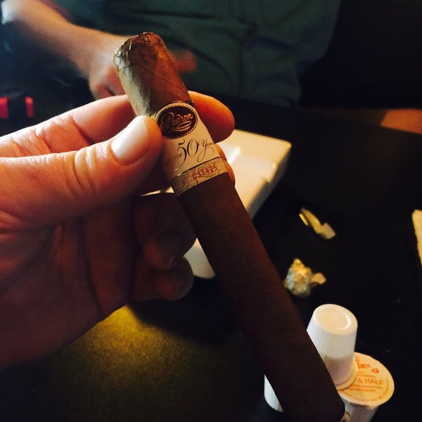 Photo taken at Elite Cigar Cafe by Larry J M. on 6/12/2015