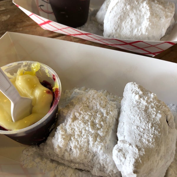Two beignets with lemon curd and berries dip! Yum!
