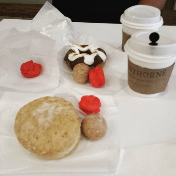 Photo taken at Holey Moley Coffee + Doughnuts by Amy S. on 9/5/2015