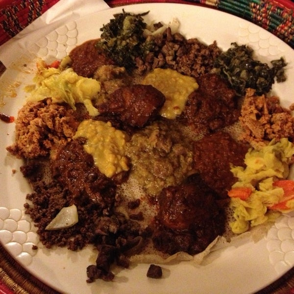 Photo taken at Messob Ethiopian Restaurant by Sarah E. on 1/13/2013