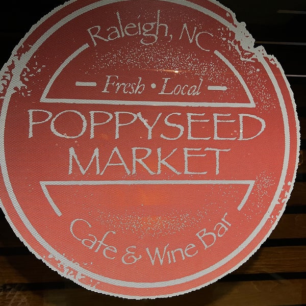 Photo taken at Poppyseed Market Café &amp; Wine Bar by Chad P. on 2/12/2023