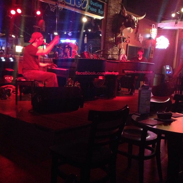 Photo taken at Louie Louie&#39;s Dueling Piano Bar by Jessica H. on 8/8/2014