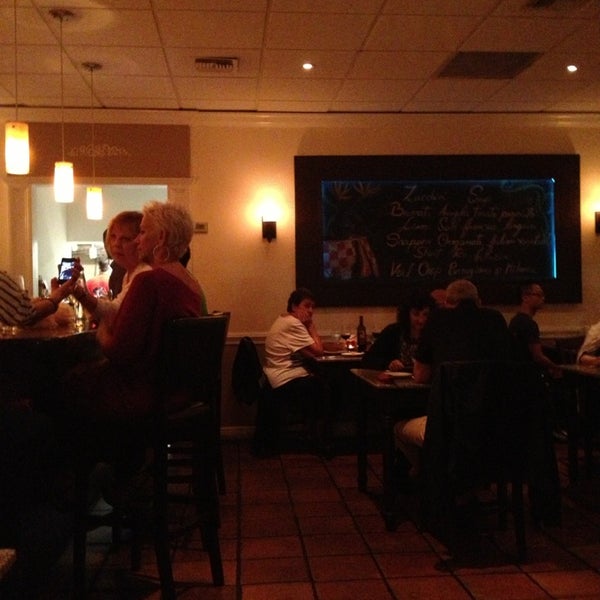 Photo taken at Lucca Restaurant by Kim S. on 1/27/2013