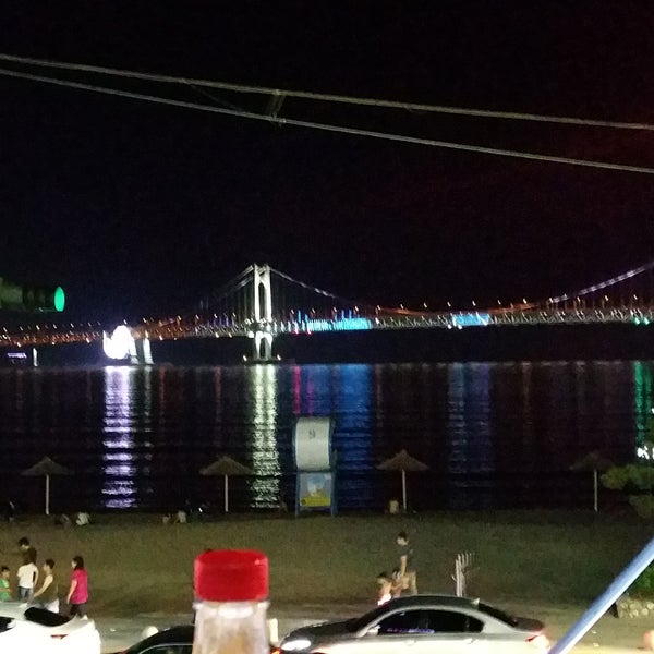 Enjoy a burger and a beer with a wonderful view of the bridge and Centum City lit up in the background.