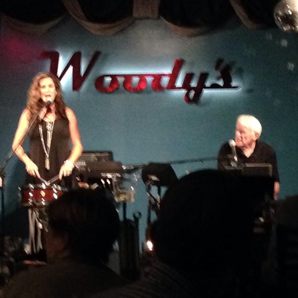 Photo taken at Woody&#39;s Burgers &amp; Beer by Ricky A. on 11/11/2014