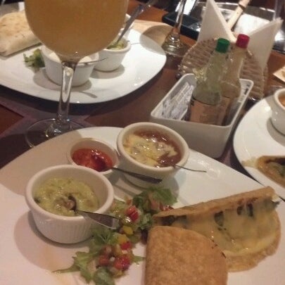 Photo taken at Mucho Gusto Gastronomia Tex-Mex by Monique S. on 1/17/2013