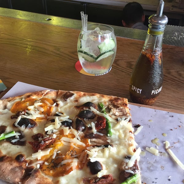 Italian veggie pizza with cucumber gin and tonic at the Barcelona beach...better than Messi