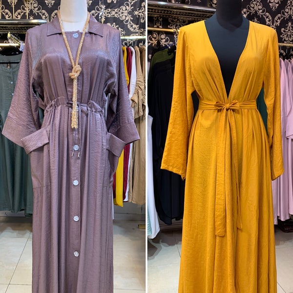 فساتين رائعة لكل المناسبات في صالة المعرض بقرية الشعب. Lovely dresses for all occasions in the exhibition hall in Al Shaab Village.