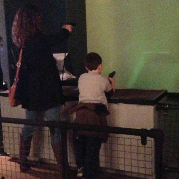 Parenting at its best. Yes, that's a mom teaching her roughly 6 year old to shoot a gun.