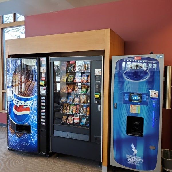 Vending machines in the back of the first floor with pop/water, coffee and snacks.