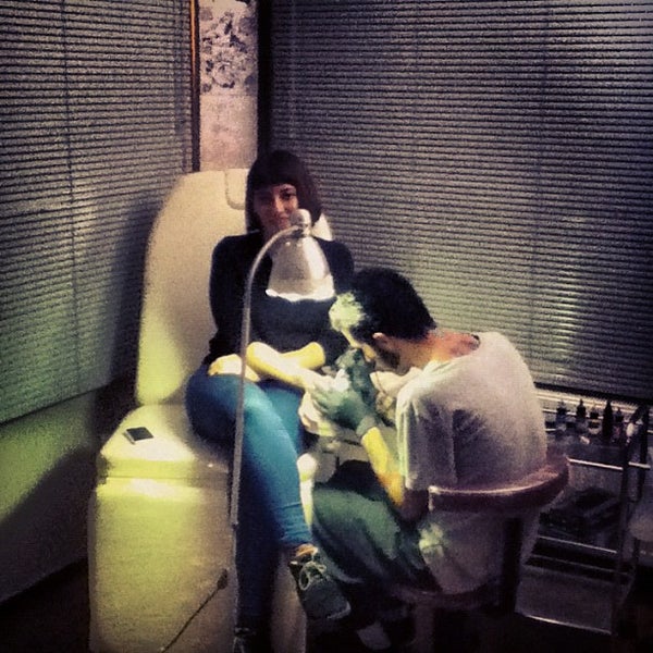 Photo taken at Roots Tattoo by Anil D. on 12/5/2012
