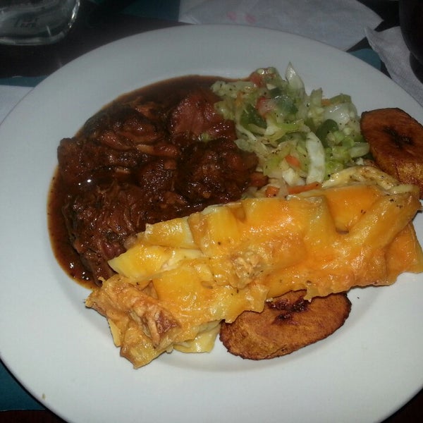 Photo taken at Janelle&#39;s Caribbean American Cuisine &amp; Bar by Mina V. on 9/7/2013