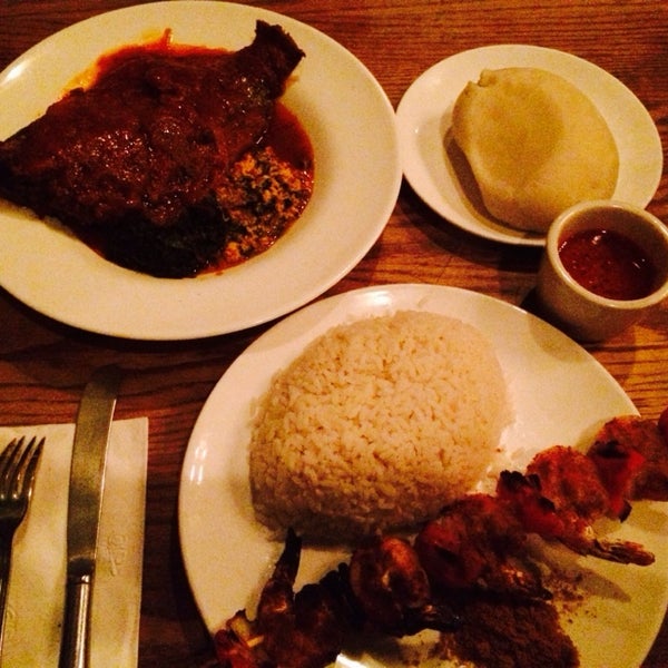 Photo taken at Buka Nigerian Restaurant by Jennifer L. on 2/1/2014