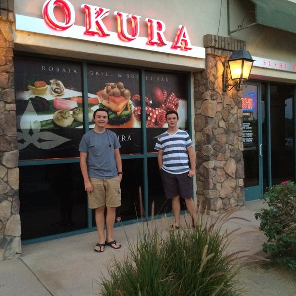 Photo taken at Okura Robata Sushi Bar and Grill by Tom A. on 8/5/2014