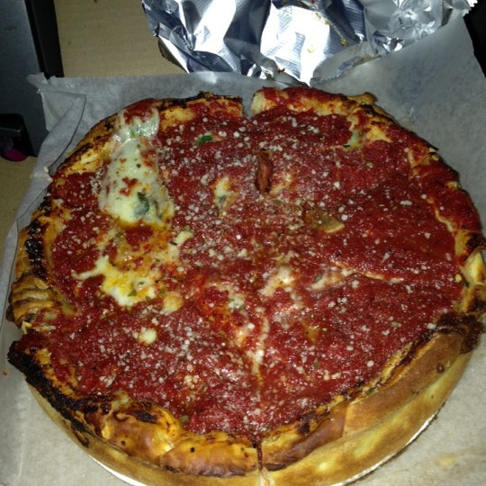 Photo taken at Nancy&#39;s Chicago Pizza by Angel M. on 11/25/2012