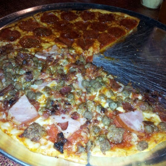 Photo taken at Theo&#39;s Neighborhood Pizza by Alex P. on 1/9/2013