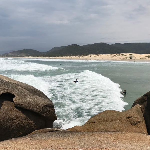 Photo taken at Praia da Joaquina by Pecopelecopeco on 11/4/2019