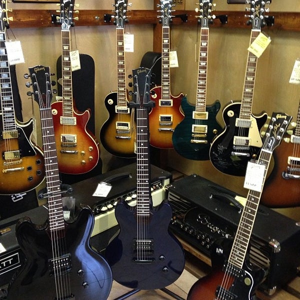 Photo taken at Gibson Shop by K. A. on 9/21/2013