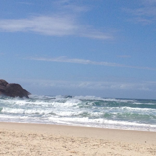 Photo taken at Praia da Joaquina by sophia z. on 4/23/2013