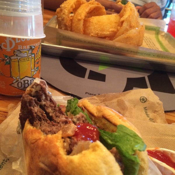Photo taken at BurgerFi by Allison T. on 8/14/2015