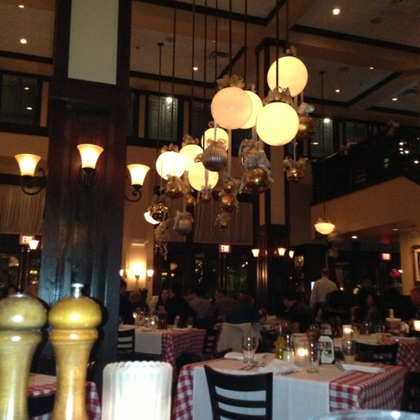 Photo taken at Maggiano&#39;s Little Italy by Brad H. on 12/29/2012