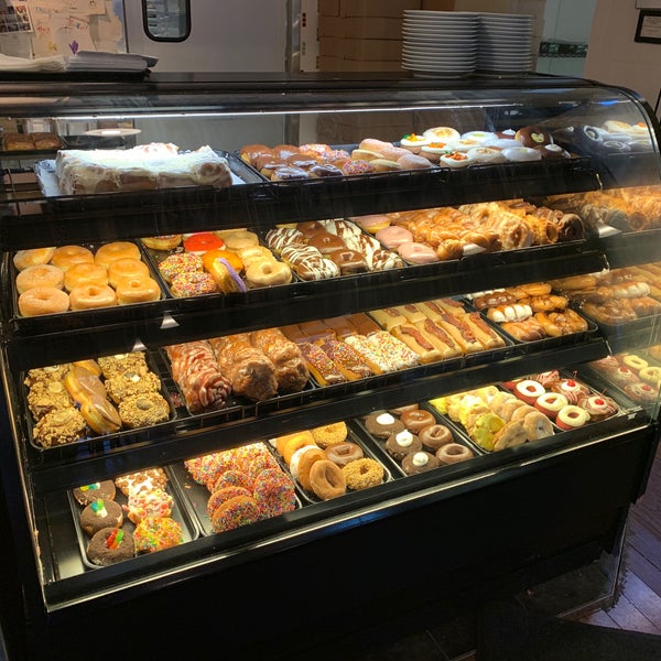 Photo taken at YoYo Donuts &amp; Coffee Bar by Nicholas K. on 4/15/2019