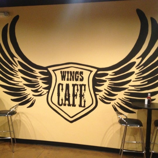 Photo taken at Wings Cafe by Justin M. on 12/8/2012