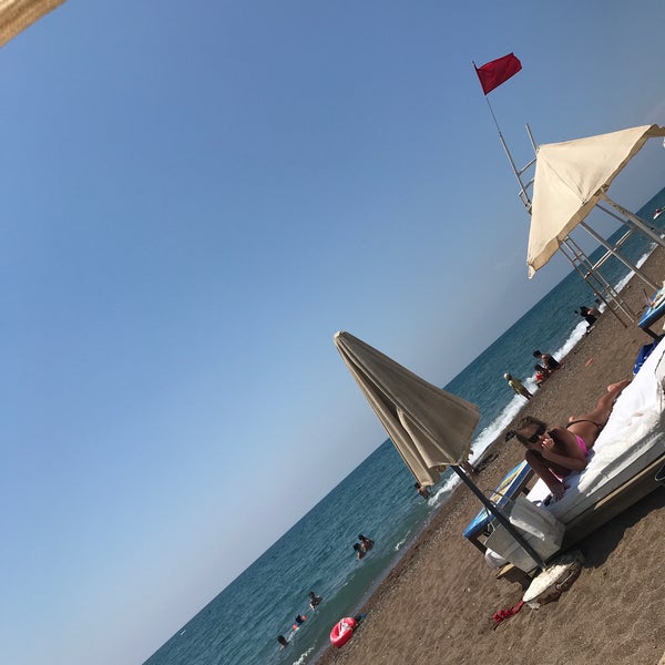 Photo taken at L&#39;Arena Beach by Fatih on 7/30/2022