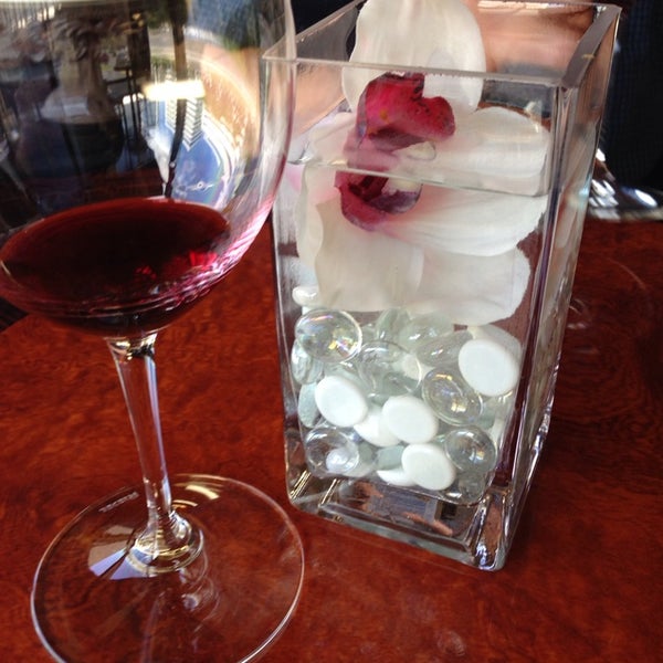 Photo taken at OC Wine Mart &amp; Tasting Bar by Devin T. on 4/5/2014