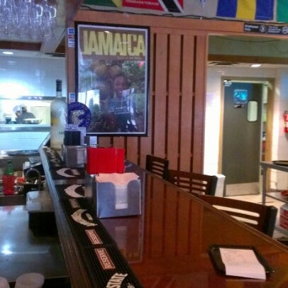 Photo taken at Jamaica Gates Caribbean Restaurant by Tametra P. on 2/9/2013