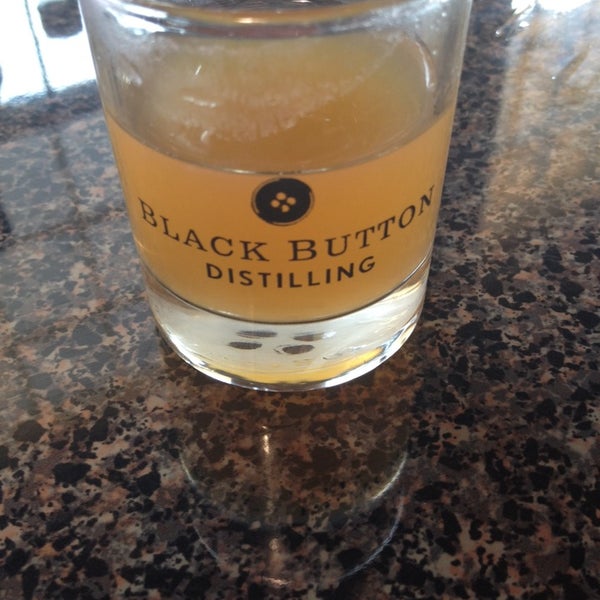 Photo taken at Black Button Distilling by Claudia B. on 8/2/2014