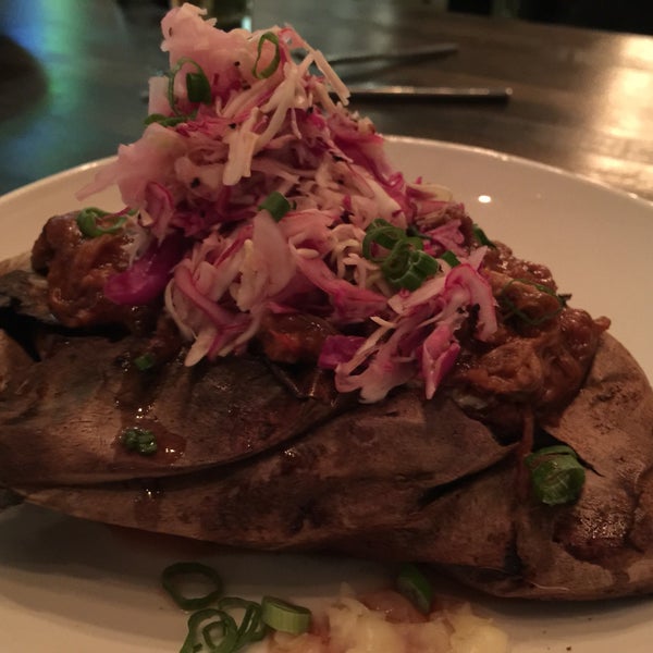 BRISKET STUFFED SWEET POTATO - 10 [ house favorite ]baked sweet potato stuffed with texas grass fed brisket, green onions, cheddar, & house BBQ sauce with cabbage slaw