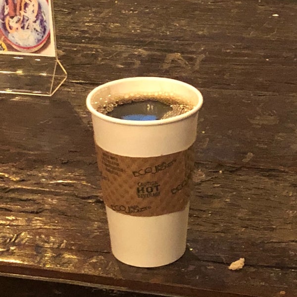 Photo taken at Black Cat Coffee by Andrew F. on 1/1/2018
