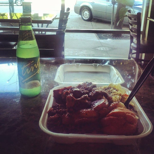 Photo taken at Ackee Bamboo Jamaican Cuisine by Justin S. on 5/13/2013