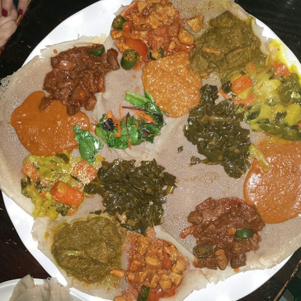 This is two veggie and two massawa combos. A good amount for four. Veggies were much better than meat. Injeera (the bread) is meant to be sour which is a bit odd. Nice experience.