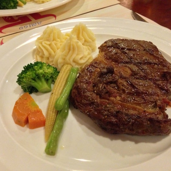 Photo taken at Amigo Grill &amp; Restaurant by 藤井 俊. on 3/21/2013