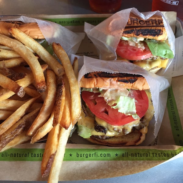 Photo taken at BurgerFi by Виктория on 10/5/2015