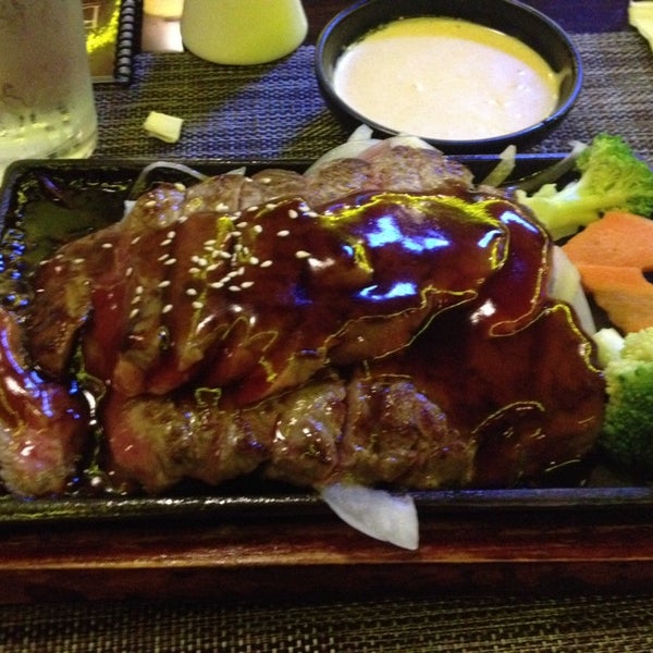 Photo taken at Bushido Japanese Restaurant by Erica D. on 5/6/2014