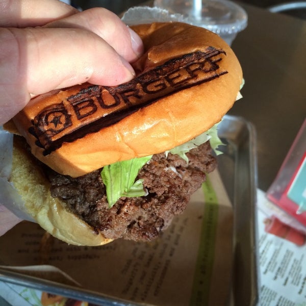 Photo taken at BurgerFi by Juan C. on 8/23/2014