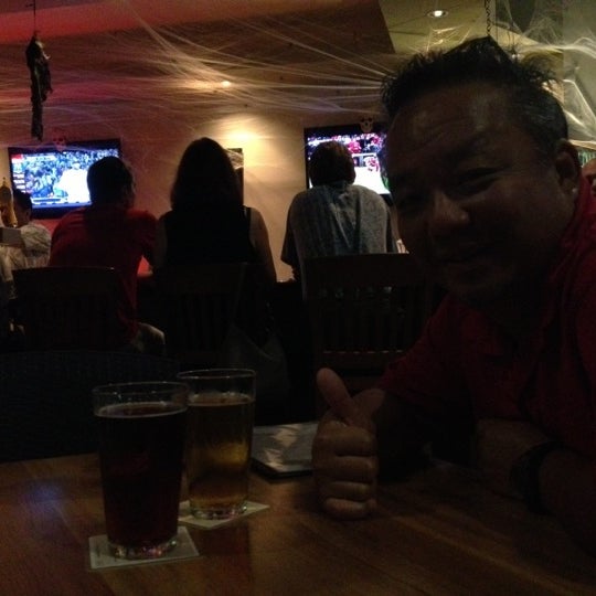 Photo taken at Aloha Beer Company by s t. on 10/13/2012