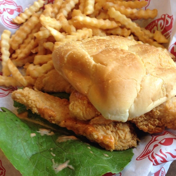 Photo taken at Raising Cane&#39;s Chicken Fingers by Rich B. on 12/28/2013