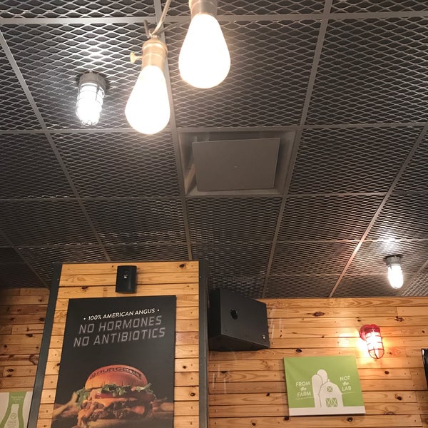 Photo taken at BurgerFi by Paola R. on 5/5/2017
