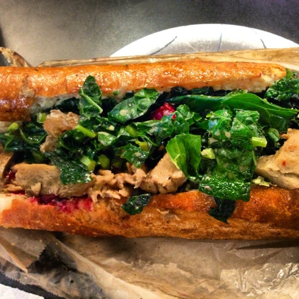 The Thanksgiving sandoo is heaven in a grilled baguette: Porcini simmered seitan, marinated kale, grilled fennel stuffing, cranberry/orange relish and garlic aioli. It's a party in your mouth!