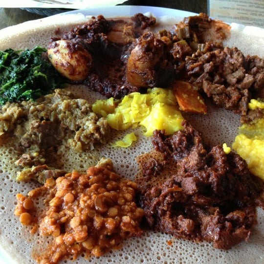 Photo taken at Queen Sheba Ethiopian Restaurant by Kevin N. on 4/22/2013