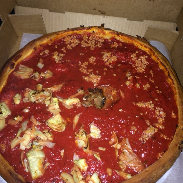 This place takes deep dish pizza to a whole new level. I got the deep dish with pepperoni, sausage, and artichoke hearts on one side and sausage, pep, and garlic on the other. SO GOOOD! Must try :)