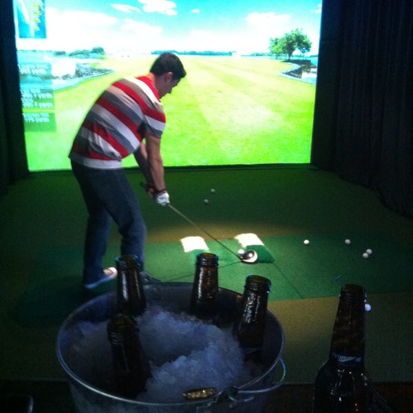 Photo taken at The Range Golf Center &amp; Sports Bar by Adam A. on 1/18/2013