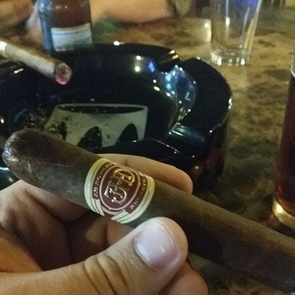 Photo taken at Crown Cigars and Ales by Foster B. on 3/2/2014