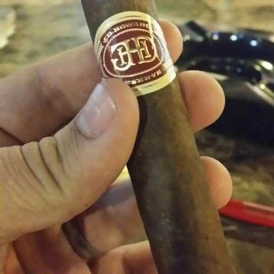 Photo taken at Crown Cigars and Ales by Foster B. on 2/28/2014