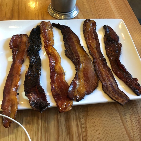 Bacon flight, green chili, breakfast burrito and orange juice