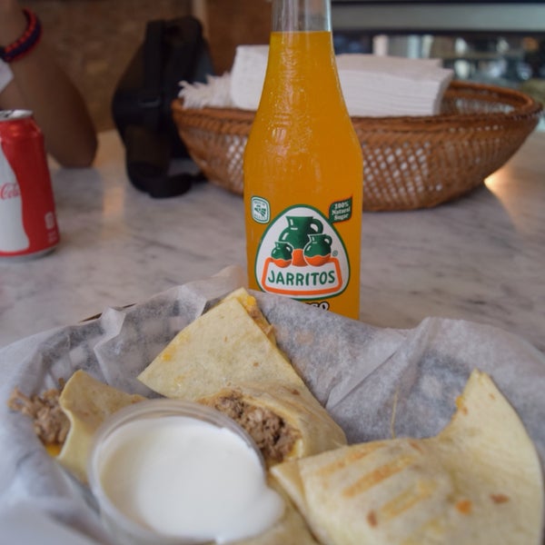 I love this place. I usually go here after school with my friends. I always get chicken quesadillas with Jarritos soda.